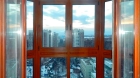 Остекление балкона окнами из лиственницы