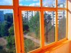 Остекление лоджии окнами из дерева лиственницы
